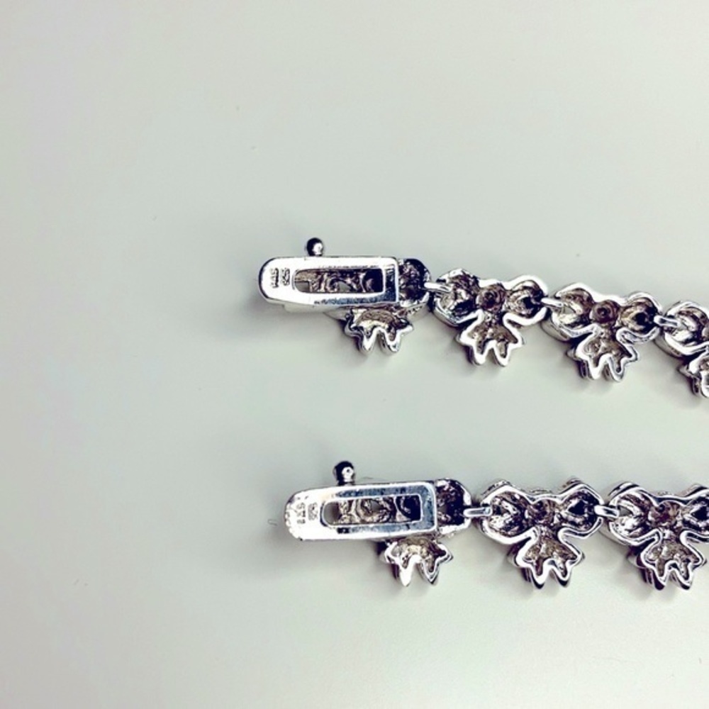 Sterling Silver String Of Bows Set Of 2 - image 4